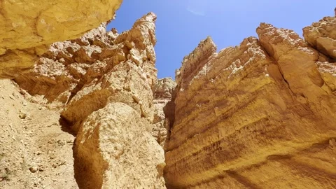 🛸 Alien World: Low Angle Red Rocks and Bright Sun in Bryce Stock Footage 337321227