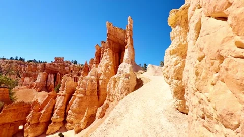 🛸 Alien World: Low Angle Red Rocks and Bright Sun in Bryce Stock Footage 337321329