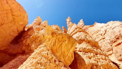 🛸 Alien World: Low Angle Red Rocks and Bright Sun in Bryce Stock Footage 337321337