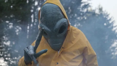 Alien in yellow suit is dancing . close up. concept of UFO Stock Footage 142122236