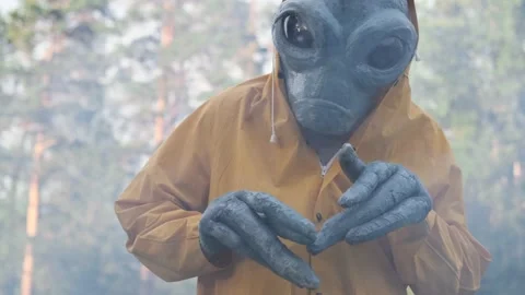 Alien in yellow suit is dancing . close up. concept of UFO Stock Footage 142122263