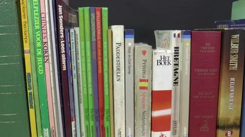 Alienation of books on a bookshelf Stock Footage 45507387