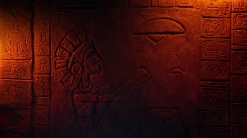 Aliens And Aztec Man Stone Relief Art In Firelight Stock Footage 142109023