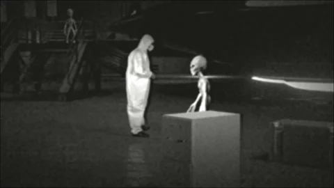 Aliens and Humans Working Together on a Flying Saucer UFO in Hangar Stock Footage 162319655