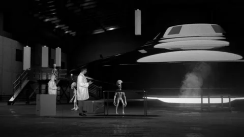 Aliens and Humans Working Together on a Flying Saucer UFO in Hangar Stock Footage 162320114