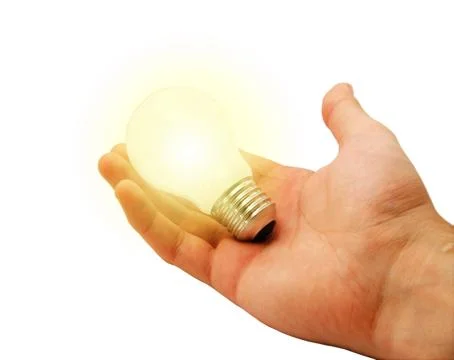 Alight bulb in hand Stock Photos