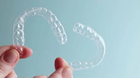 Aligners for aligning teeth on a blue ba... | Stock Video | Pond5