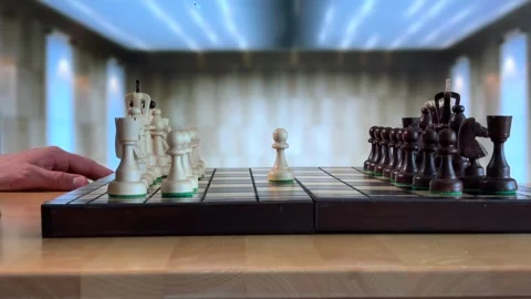 Aligning Chess Pieces During Setup on Table Stock Footage 310139212