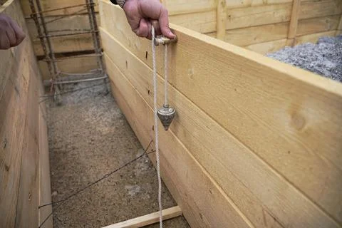 Aligning the formwork to the level for pouring concrete  Stock Photos