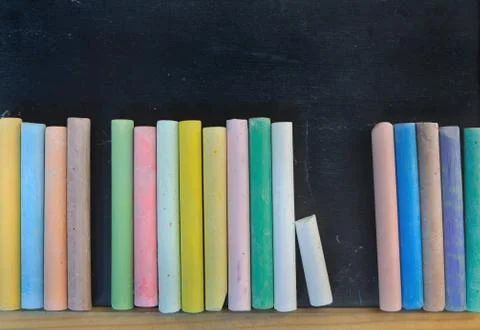 Alignment of colored chalks Stock Photos