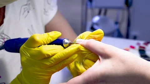 Alignment of nails and treatment of nails with an electric machine. Stock Footage 131248094