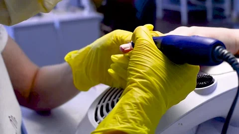 Alignment of nails and treatment of nails with an electric machine. Stock Footage 131248215
