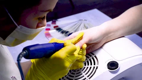 Alignment of nails and treatment of nails with an electric machine. Stock Footage 131962211