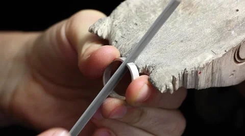 Alignment of surfaces silver blanks for rings with a file(tool) Video stock 56315516