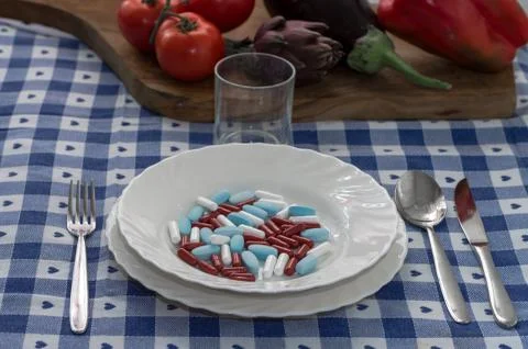 Alimentation with pills food Stock Photos