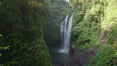 Aling-Aling Waterfall cascades through lush green cliffs in northern Bali Stock Footage 313611510