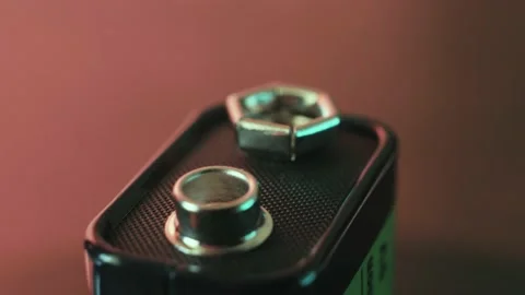 Alkaline 9 volt battery rotating close up Stock Footage 171039867