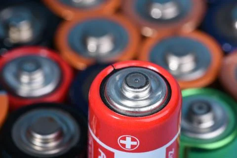Alkaline batteries with selective focus on single one Stock Photos