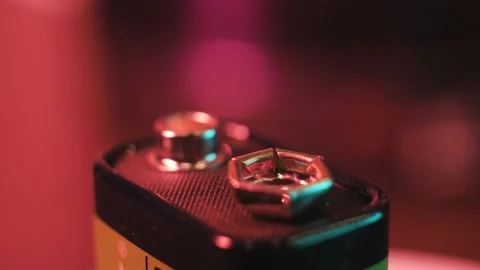 Alkaline battery rotates on a colored background Stock Footage 171040121