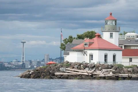 Alki Point Lighthouse and Space Needle on Cloudy Day Stock Photos
