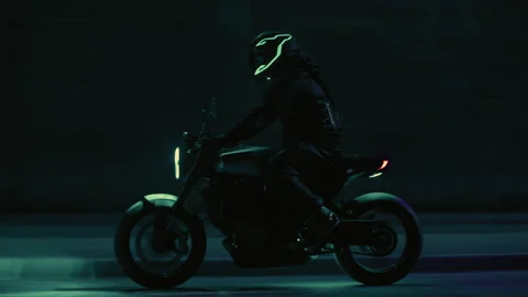 All black Motorcyclist driving on the road at night Stock Footage 264108053