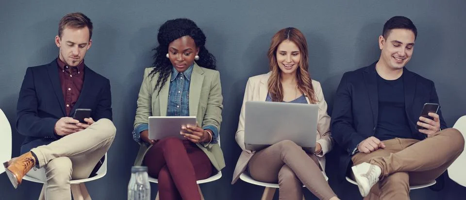 All checking the job post for the interview. a group of businesspeople using Foto stock