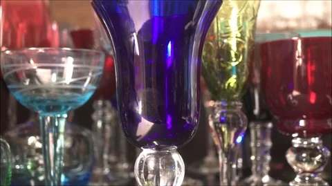 All colors of glasses on the table. Video stock 88439350