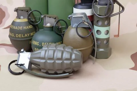 All explosives, weapon army,standard time fuze, hand grenade on camouflage ba Foto stock