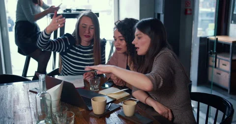 All-female teamwork concept. Three beautiful diverse business partners using Stock Footage 152570410