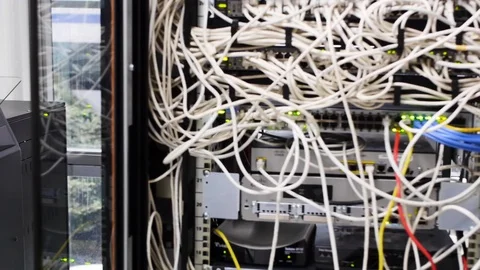 All messed up cables with cabinets and racks full of switches fc01 Stock Footage 102220147