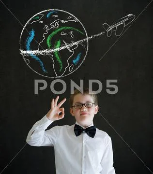 All ok boy dressed as business man with chalk globe and jet world travel on b Stock Photos