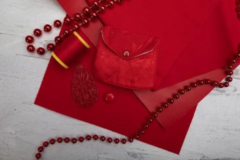 All red background texture fabric beads spool of thread button Stock Photos
