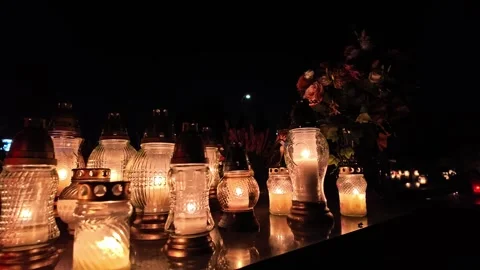 All Saints catholic sacred tradition memorial with candles, laterns and flowers Stock Footage 293479928