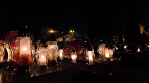 All Saints catholic sacred tradition memorial with candles, laterns and flowers Stock Footage 293479952