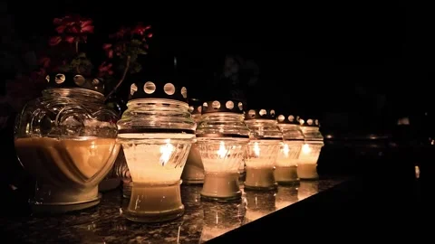 All Saints catholic sacred tradition memorial with candles, laterns and flowers Stock Footage 293480080