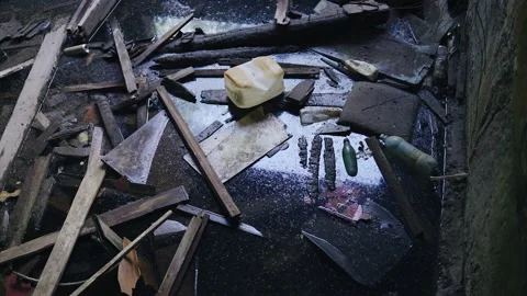 All sorts of junk and garbage floats in the water in the flooded basement Stock Footage 154660720