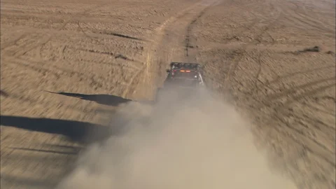 All-Terrain Vehicle driving in desert area during competition Stock Footage 105584053