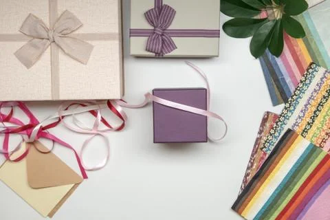 All things for gift wrapping. Present box with bow. Ribbon and color paper. Stock Photos