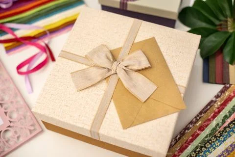 All things for gift wrapping. Present box with bow. Ribbon and color paper. Stock Photos