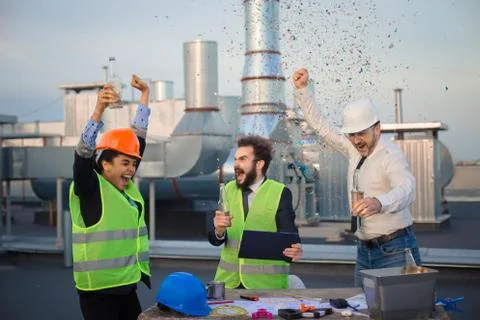 All three of the construction workers were ecstatic and the atmosphere was Stock Photos