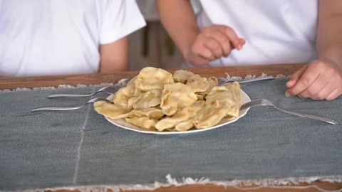 All together take a fork dumplings at the same time Video stock 106184262