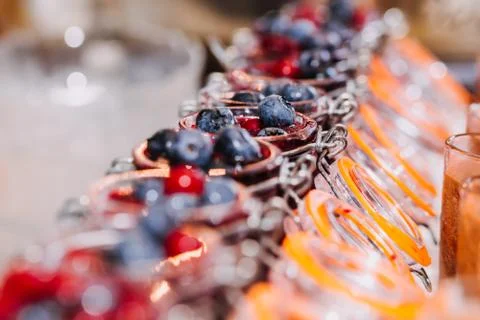 All types of berries in small jars Stock Photos