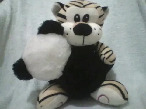 All you need is a hug, stuffed tiger hugs panda fondly Stock Footage 162146557