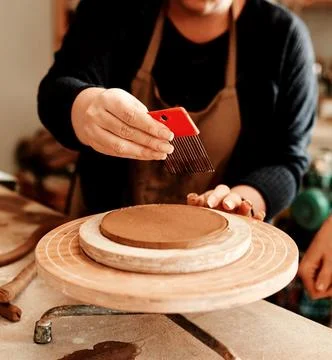 All you need is the right tools. an unrecognizable artisan working in a pottery Fotos Stock