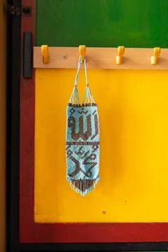Allah Muhammad calligraphy made from tiny beads hanging on a cabinet. 스톡 사진