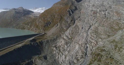 Allalin glacier to Mattmark barrage panoramic - Aerial 4K Stock Footage 116208302