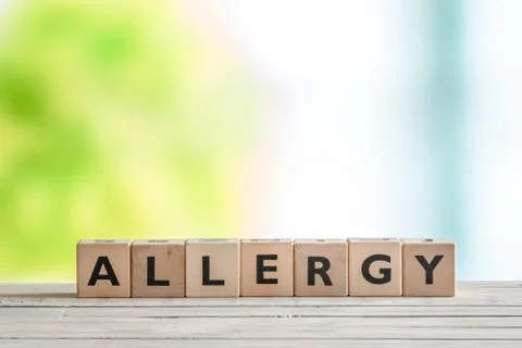 Allergy message sign on a table Stock Photos