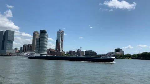 Alliance ship going through Meuse (Maas) river. Rotterdam city skyline Stock-Footage 145231045