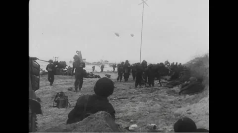 Allied soldiers on beach at Normandy Stock Footage 44574797