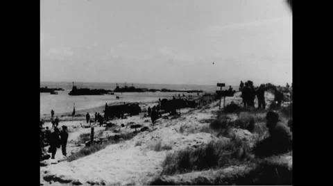 Allied soldiers on beach at Normandy Stock Footage